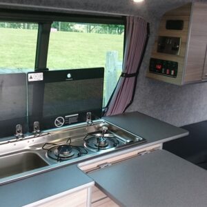 2020.06 VW T6 SWB Conversion Kitchen Area with Lids Open on Sink and Hob