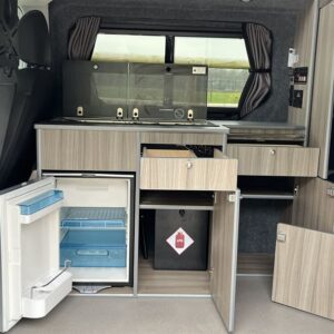Ford Transit Custom LWB Full Conversion View of Kitchen With Cupboards Open