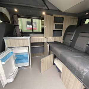 2020.09 VW T6.1 SWB Conversion Inside View with Storage Cupboards Open