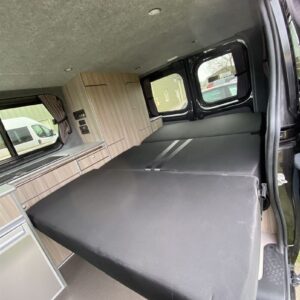2021.02 Vivaro SWB Conversion View of RIB Seat in Bed Position