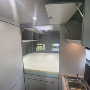 2021.06 VW Crafter MWB Conversion Inside View with Open Storage Cupboards