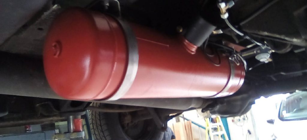 View of an Underslung Gas Tank Being Fitted